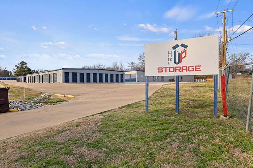 Vehicle pulled up to a drive-up commercial space at FreeUp Storage Tyler