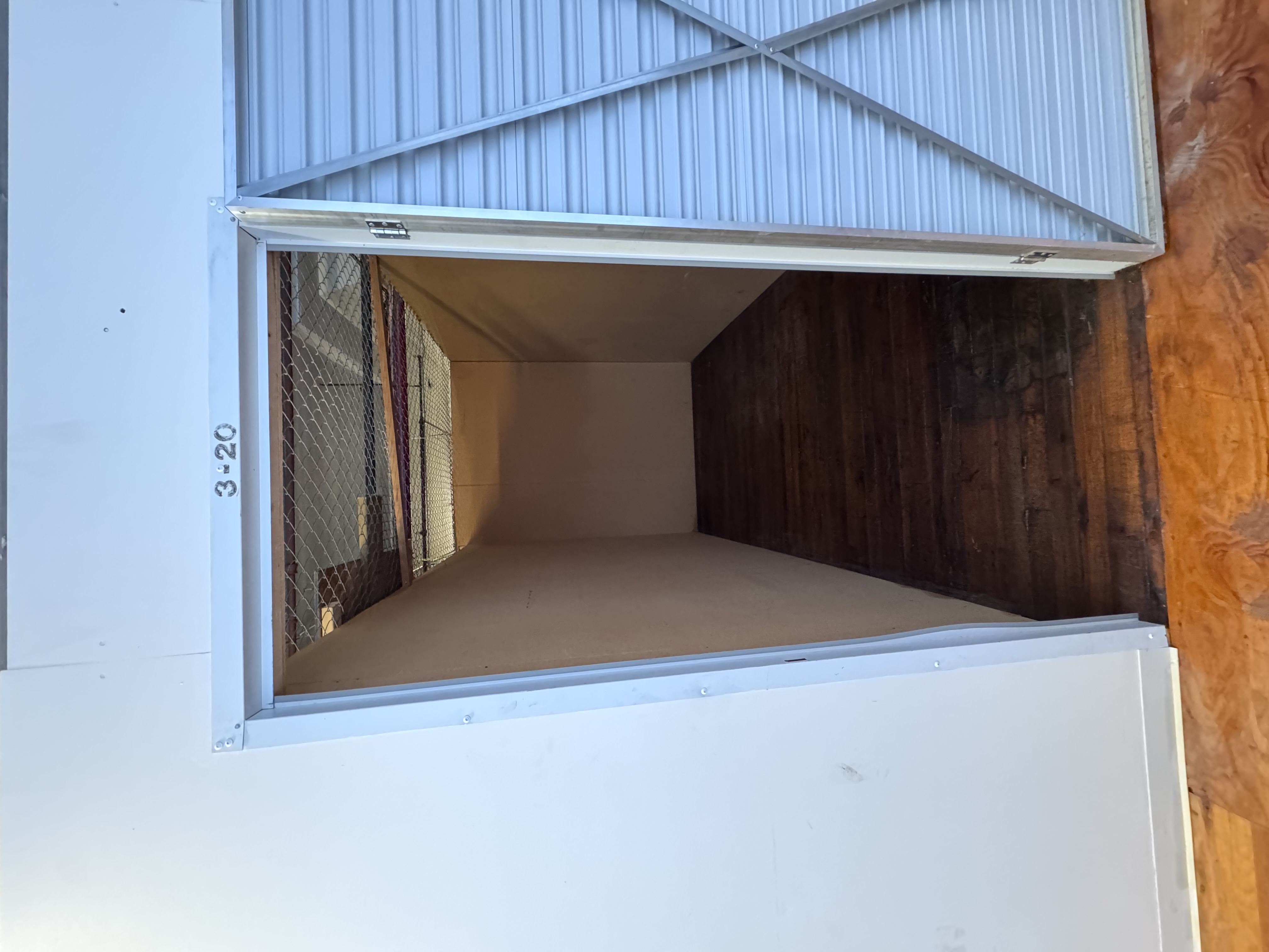 Interior view of a clean, well-lit storage unit with ample space for secure item storage.