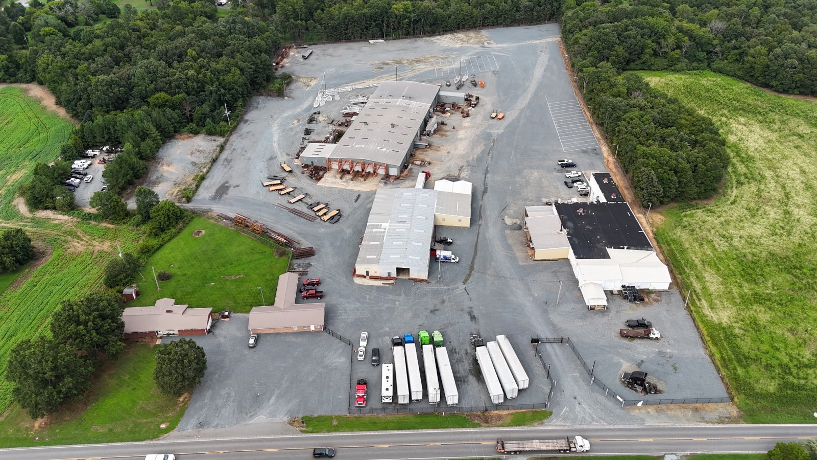 Aerial view of Total Space Storage in North Carolina featuring secure truck, boat, and RV parking with spacious paved lots and easy access.