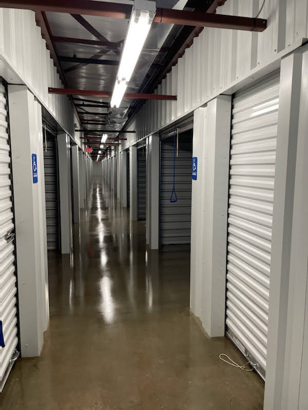 hallway with interior access storage units