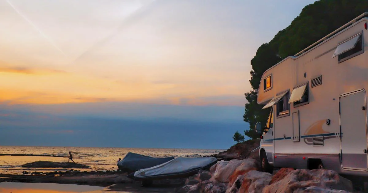 Why Fall Might Be the Perfect Time to RV in Southwest Florida RV parked by the beach at sunset