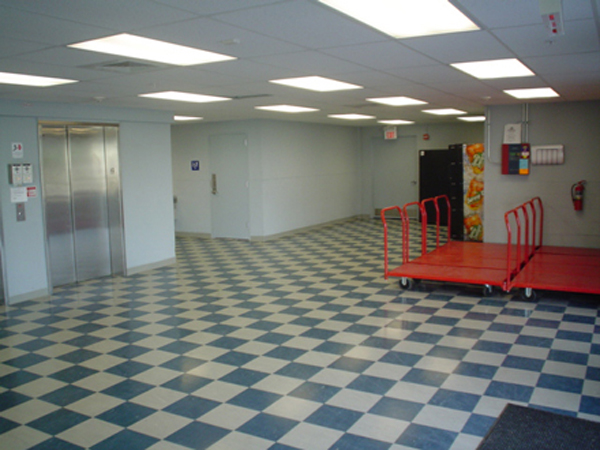 facility entrance with elevator and moving carts