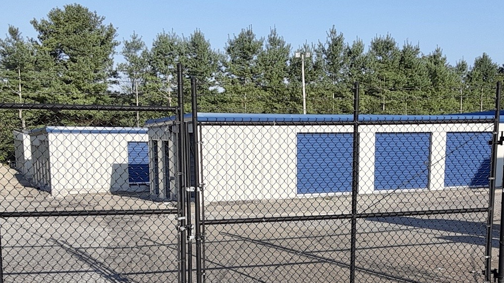 Self storage building behind fence