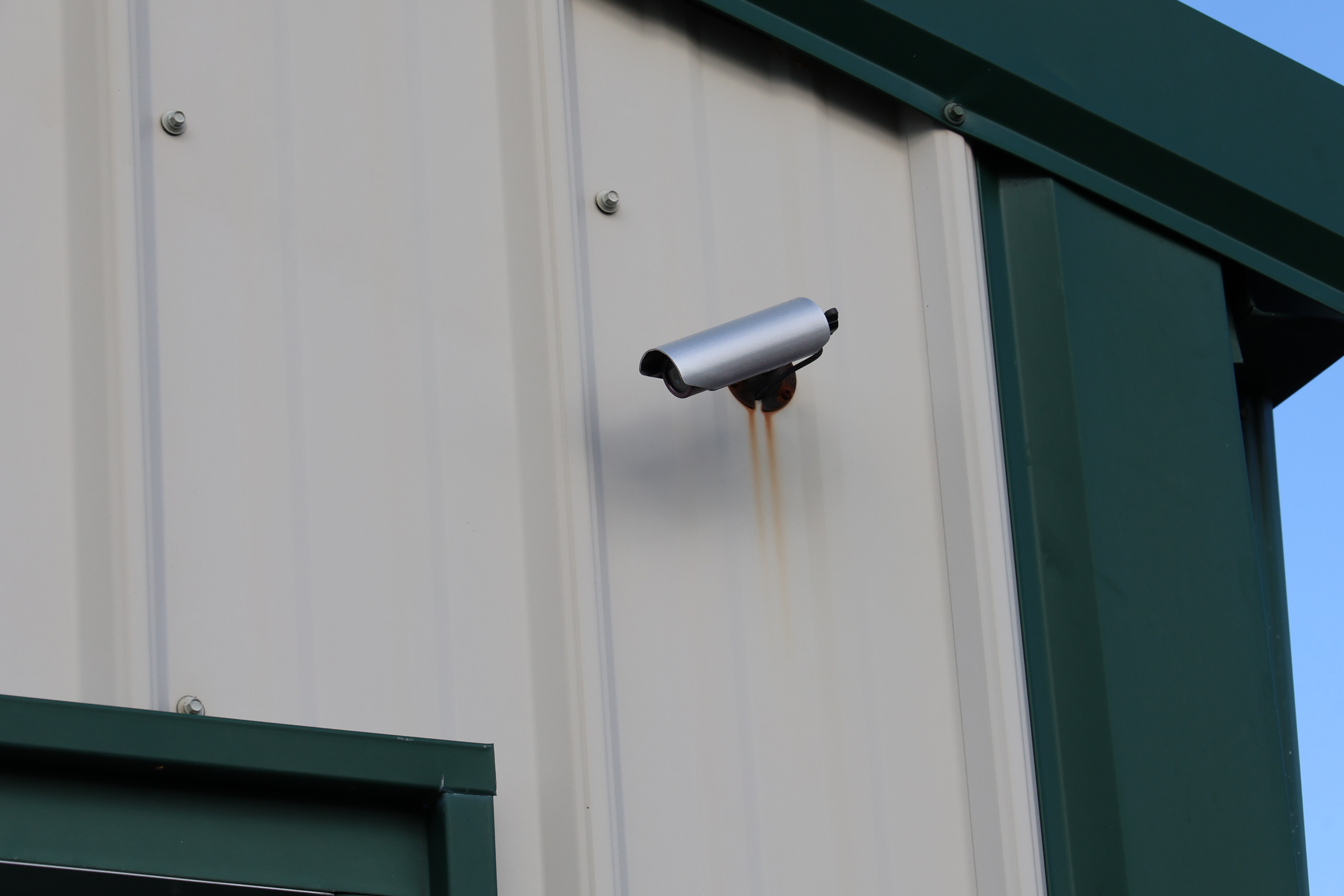 Security camera mounted on A-Verdi Self Storage Darien Center building providing 24/7 video surveillance