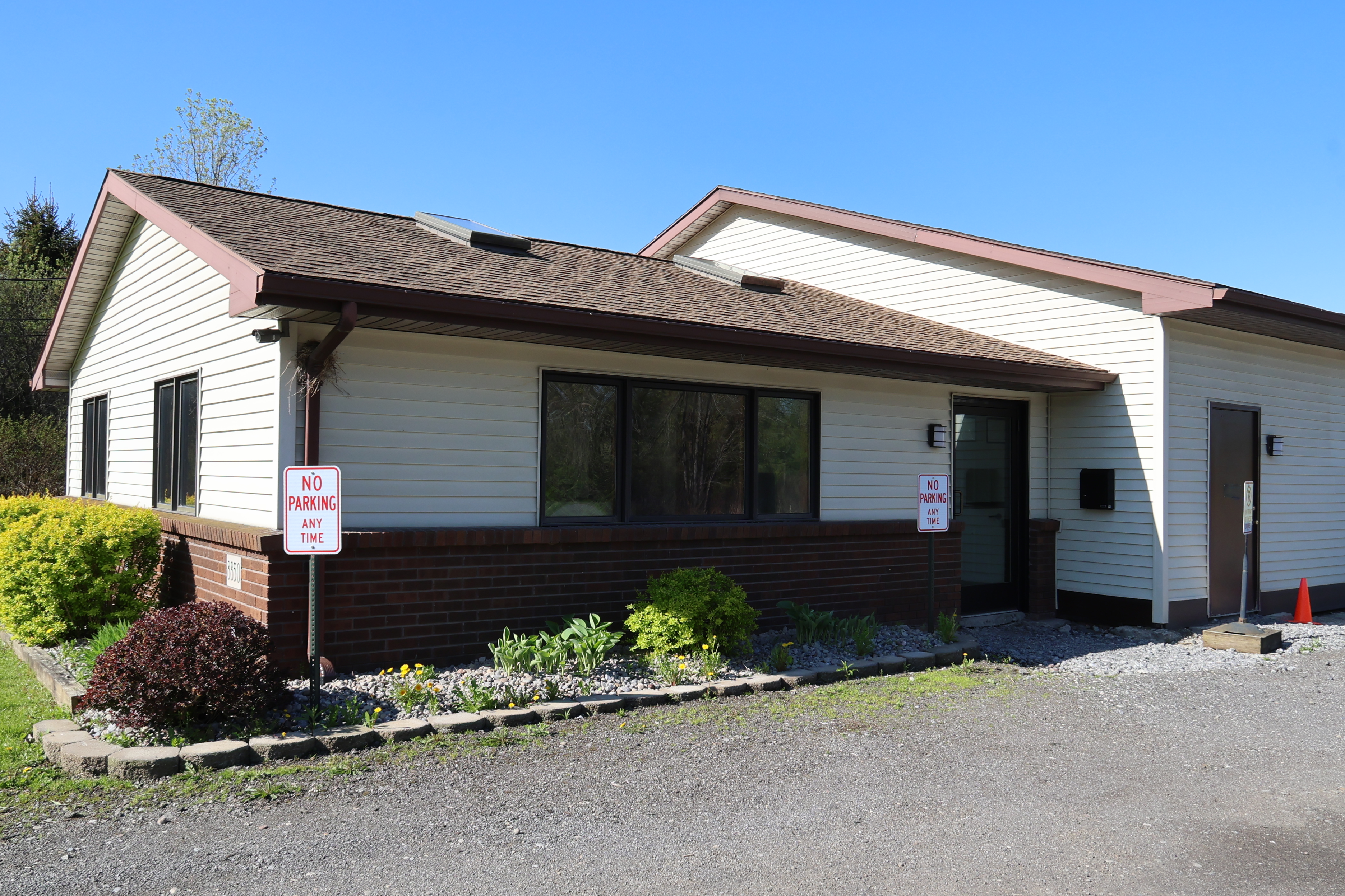 Exterior of the A-Verdi Self Storage Batavia office building with customer parking and landscaped grounds