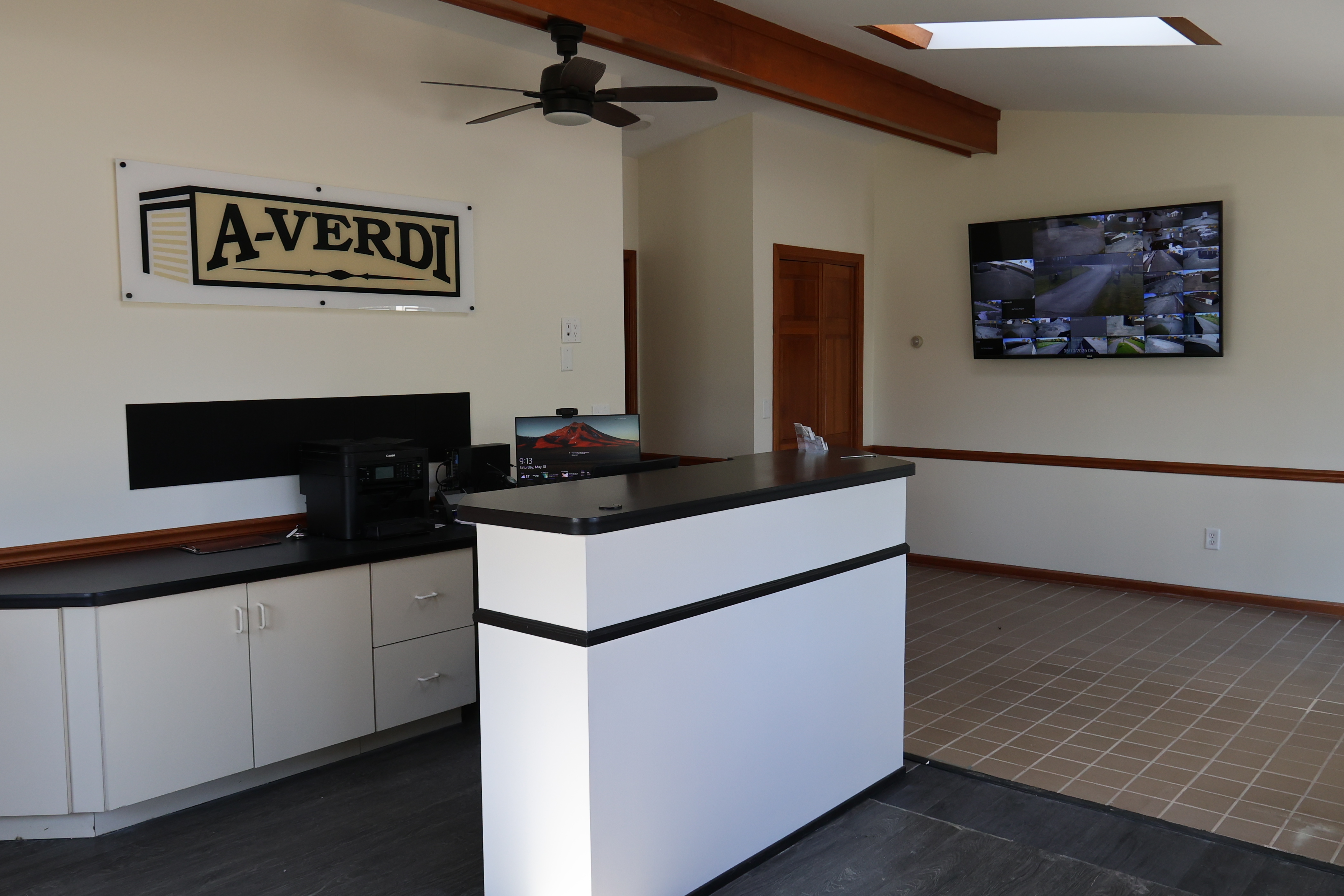 Interior of A-Verdi Self Storage Batavia office featuring front desk, customer service area, and security monitors