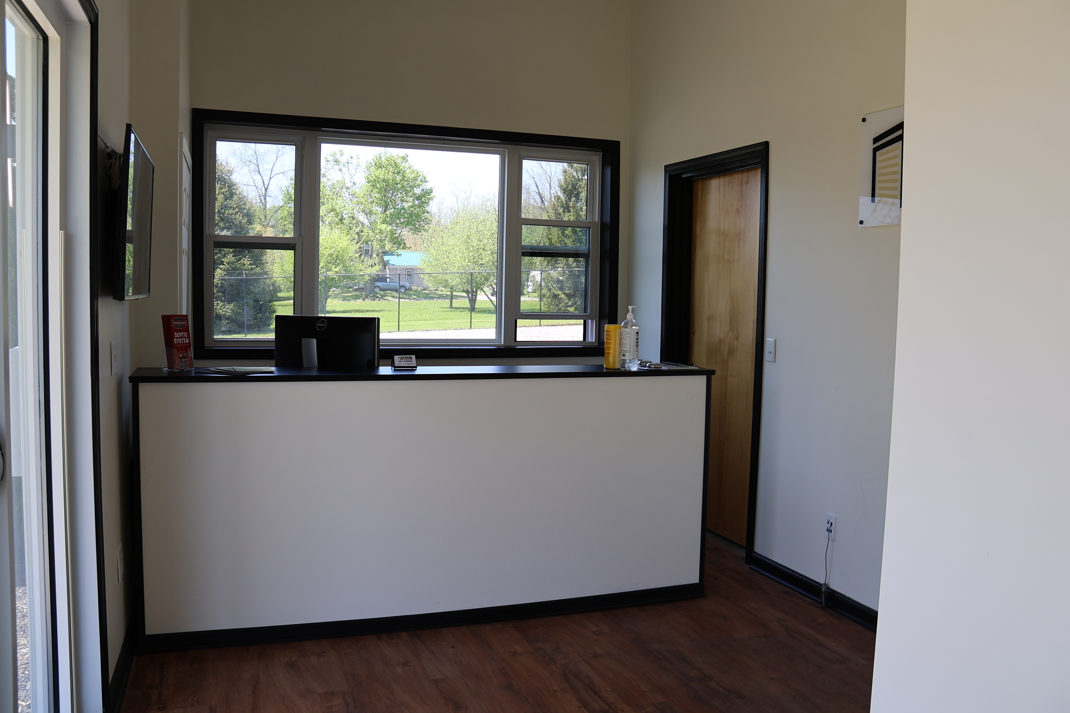 Interior of the A-Verdi Self Storage Waterloo office showing customer service counter, windows, and clean modern finishes