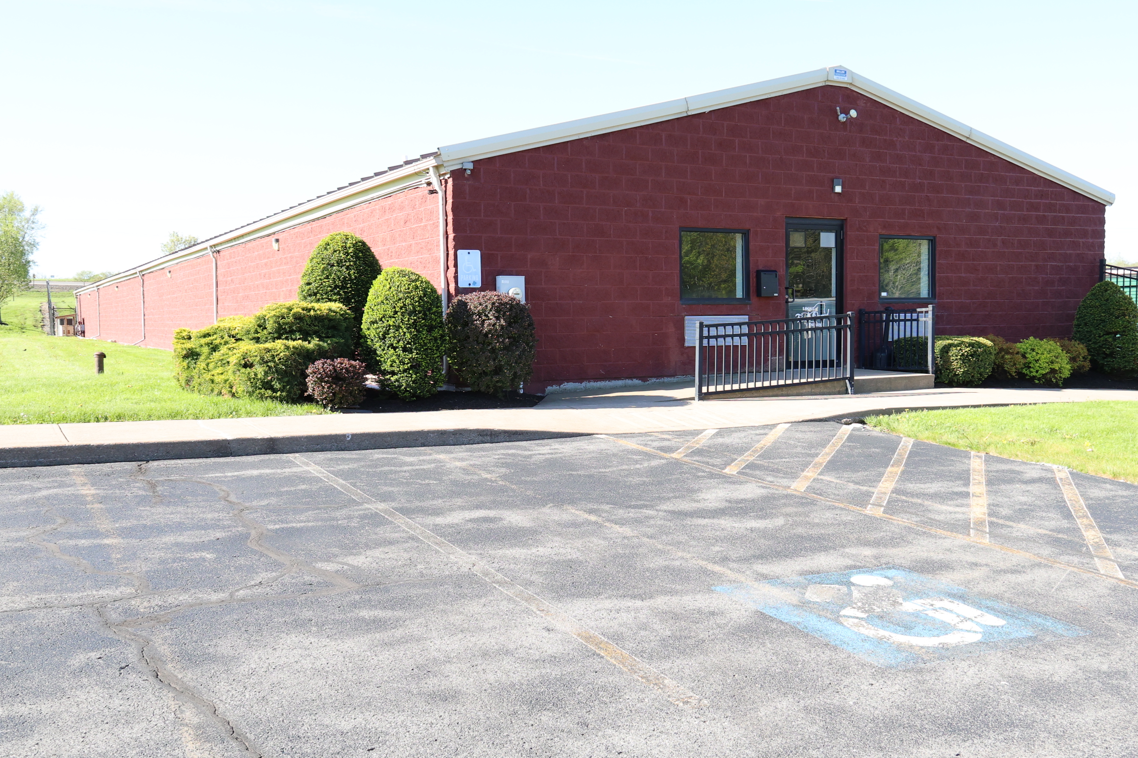 Exterior of the A-Verdi Self Storage Baldwinsville office building with accessible entrance and customer parking