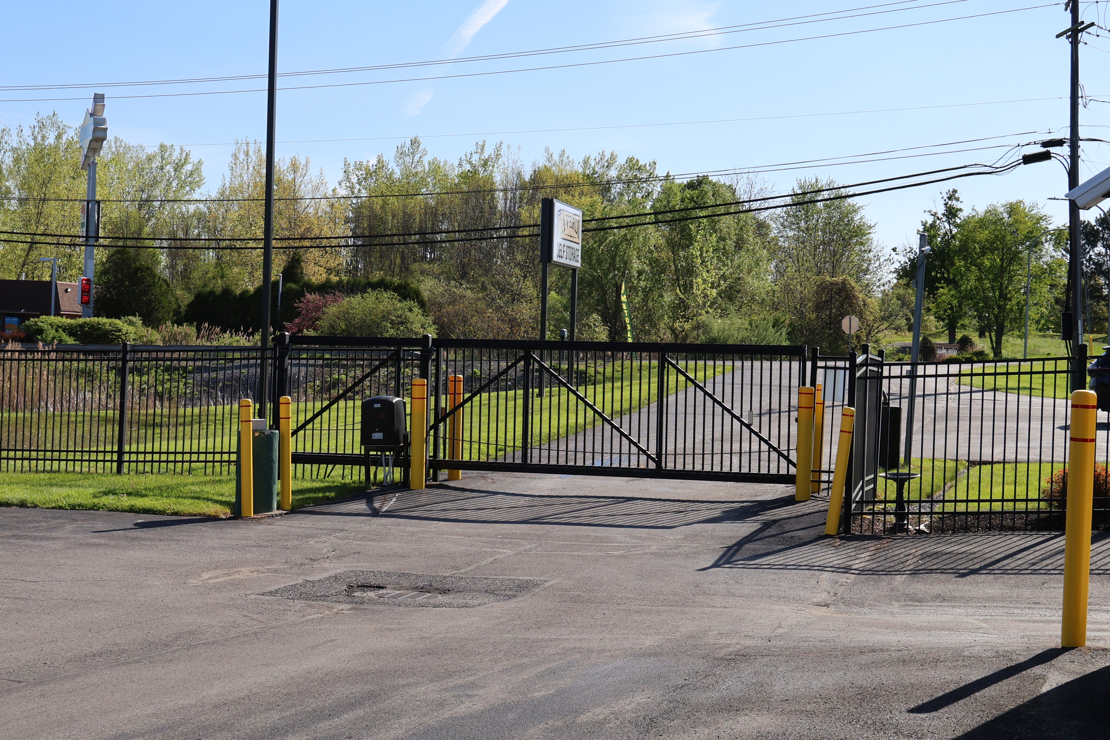 Secure gated entrance at A-Verdi Self Storage Baldwinsville with controlled access and perimeter fencing
