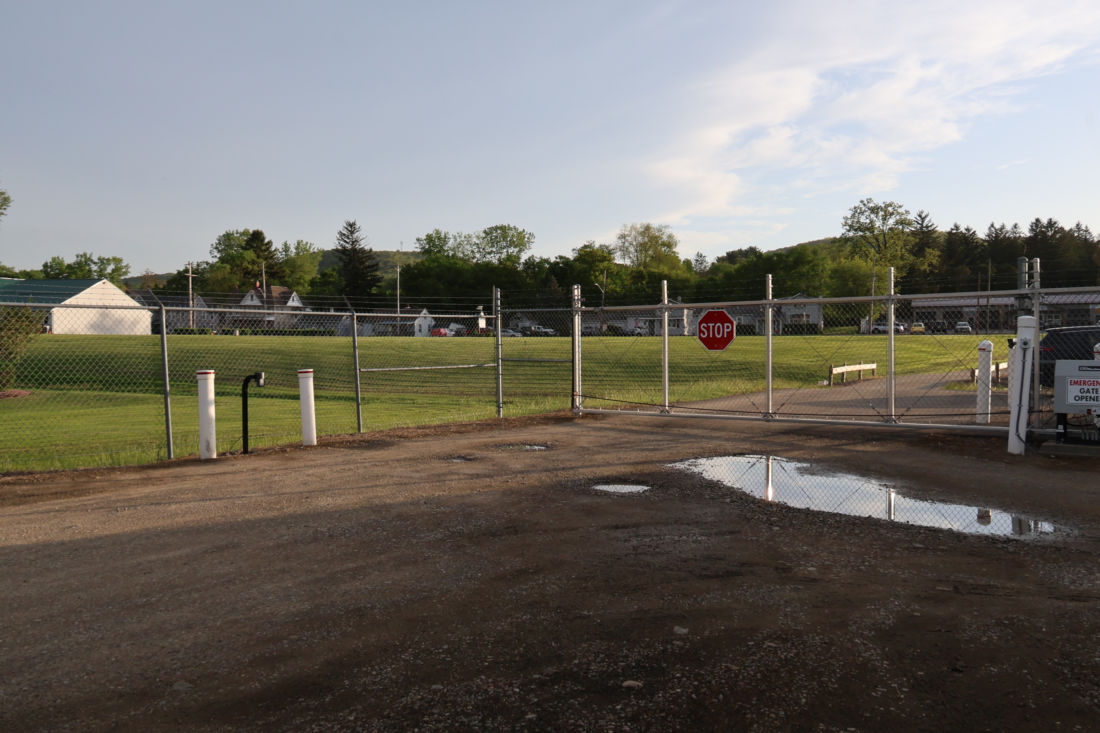 Perimeter security gate at A-Verdi Self Storage Corning with fenced access and controlled entry system