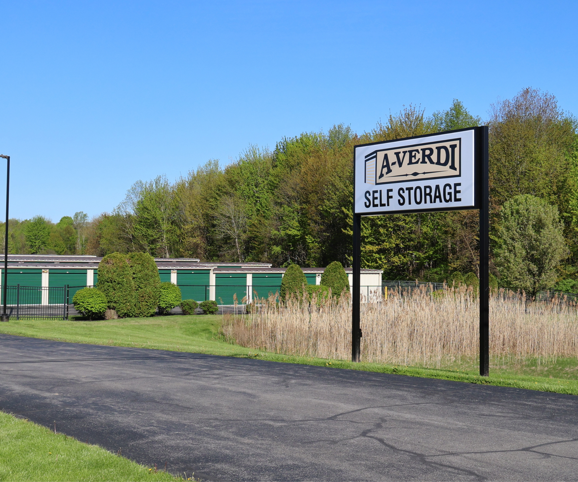 A-Verdi Self Storage sign at facility on a sunny day