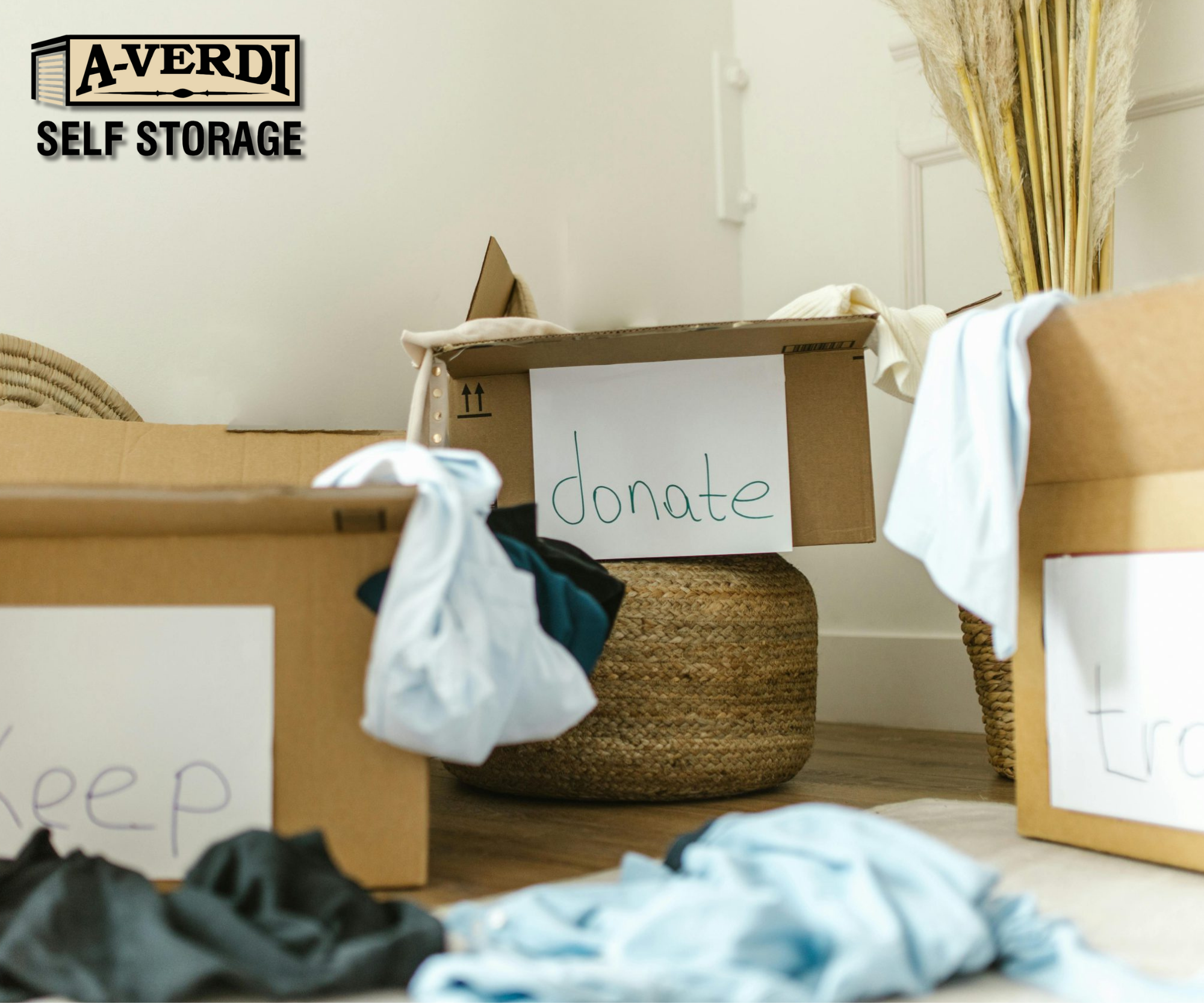 New Year Decluttering Tips for a Fresh Start (With Help from A-Verdi Self Storage) Cardboard boxes labeled keep, donate, and trash used in a home decluttering system before moving items into storage.