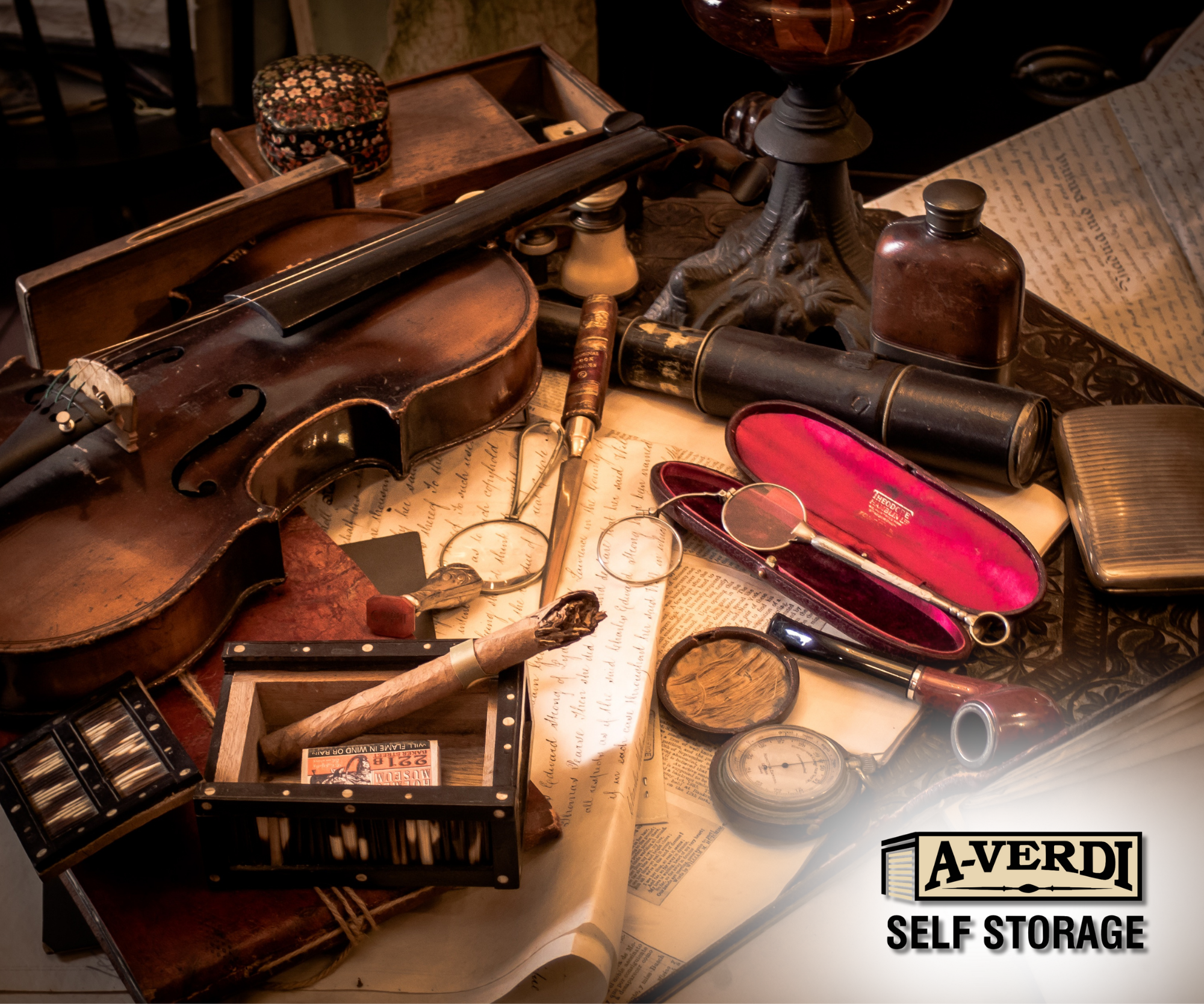 Vintage sentimental items including a violin, handwritten letters, antique eyeglasses, and keepsakes carefully arranged to represent safe storage of fragile heirlooms in a self storage unit.