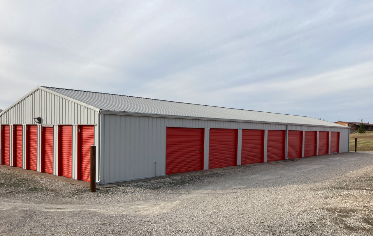 Exterior view of Superior Storage in Wheelersburg, OH, showcasing clean facilities with bright orange doors and wide driveways for easy access.