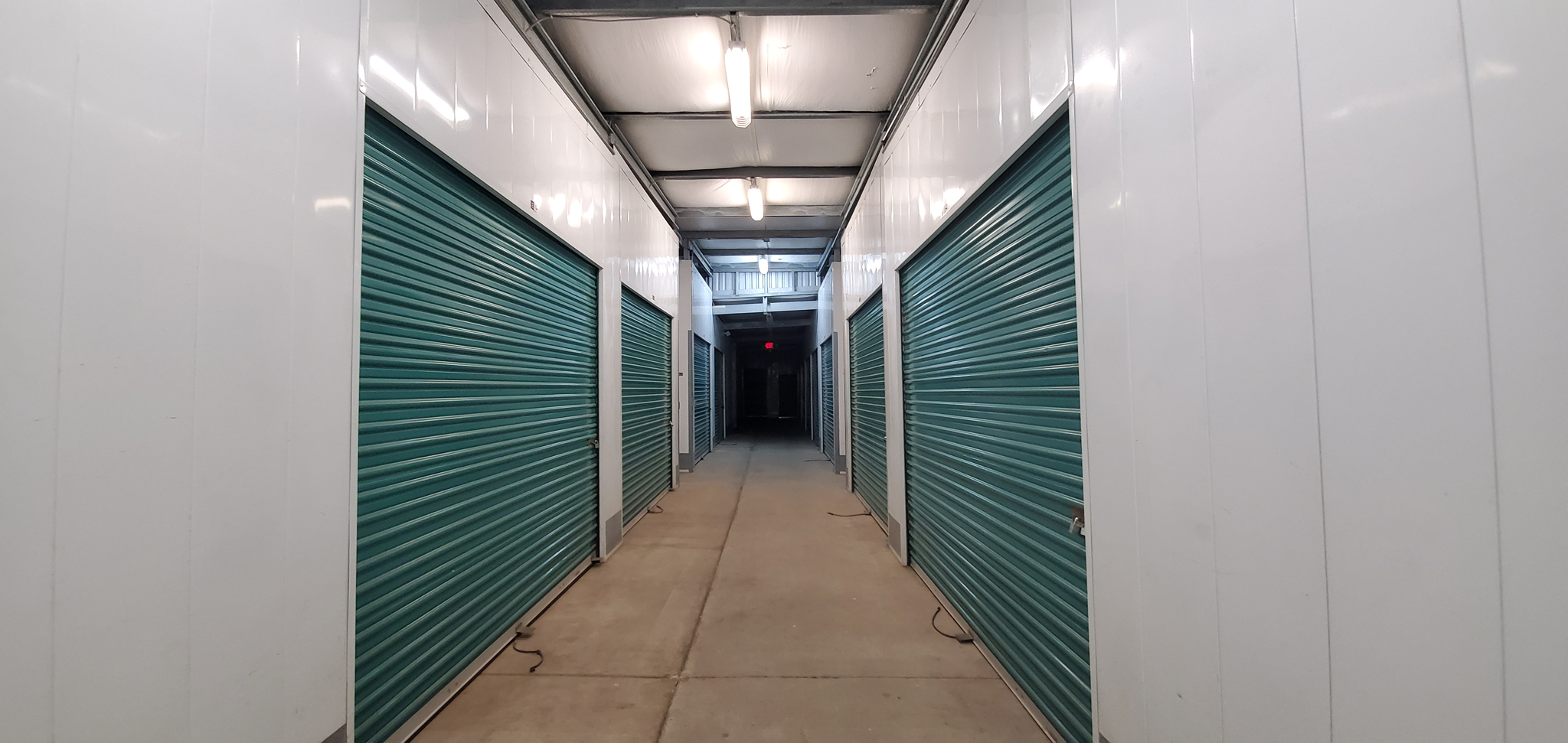 Hallway with interior storage units on both sides