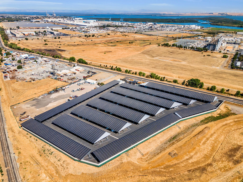 Aerial drone view of LuxeGuard RV and Boat Storage in Pittsburg, CA with covered parking and wide driveways.
