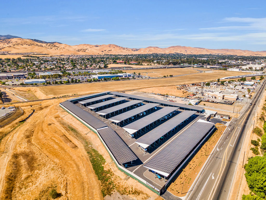 Aerial drone view of LuxeGuard RV and Boat Storage in Pittsburg, CA with covered parking and wide driveways.
