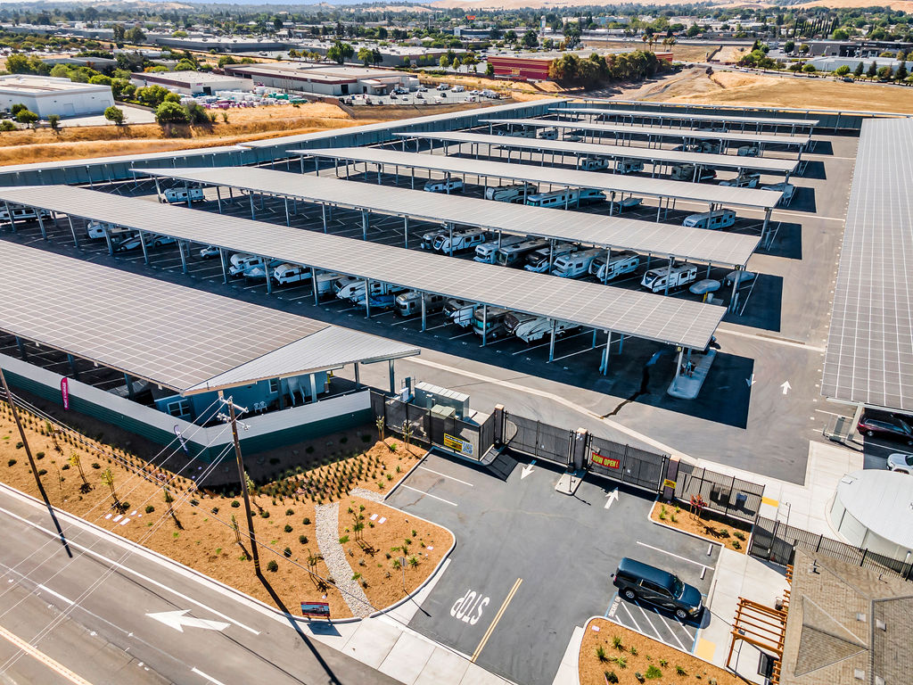 Aerial drone view of brand new LuxeGuard RV & Boat Storage in Pittsburg, CA with covered parking and wide driveways.