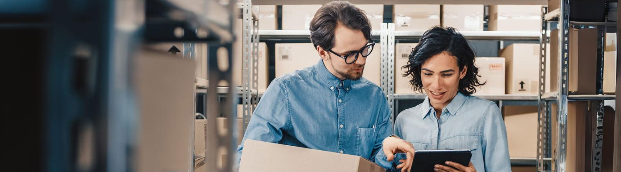 Team organizing storage boxes