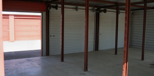 Interior of large self storage unit with roll up doors