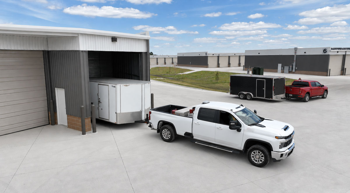 Contractor work trailer and equipment inside an enclosed storage bay in Bondurant, Iowa