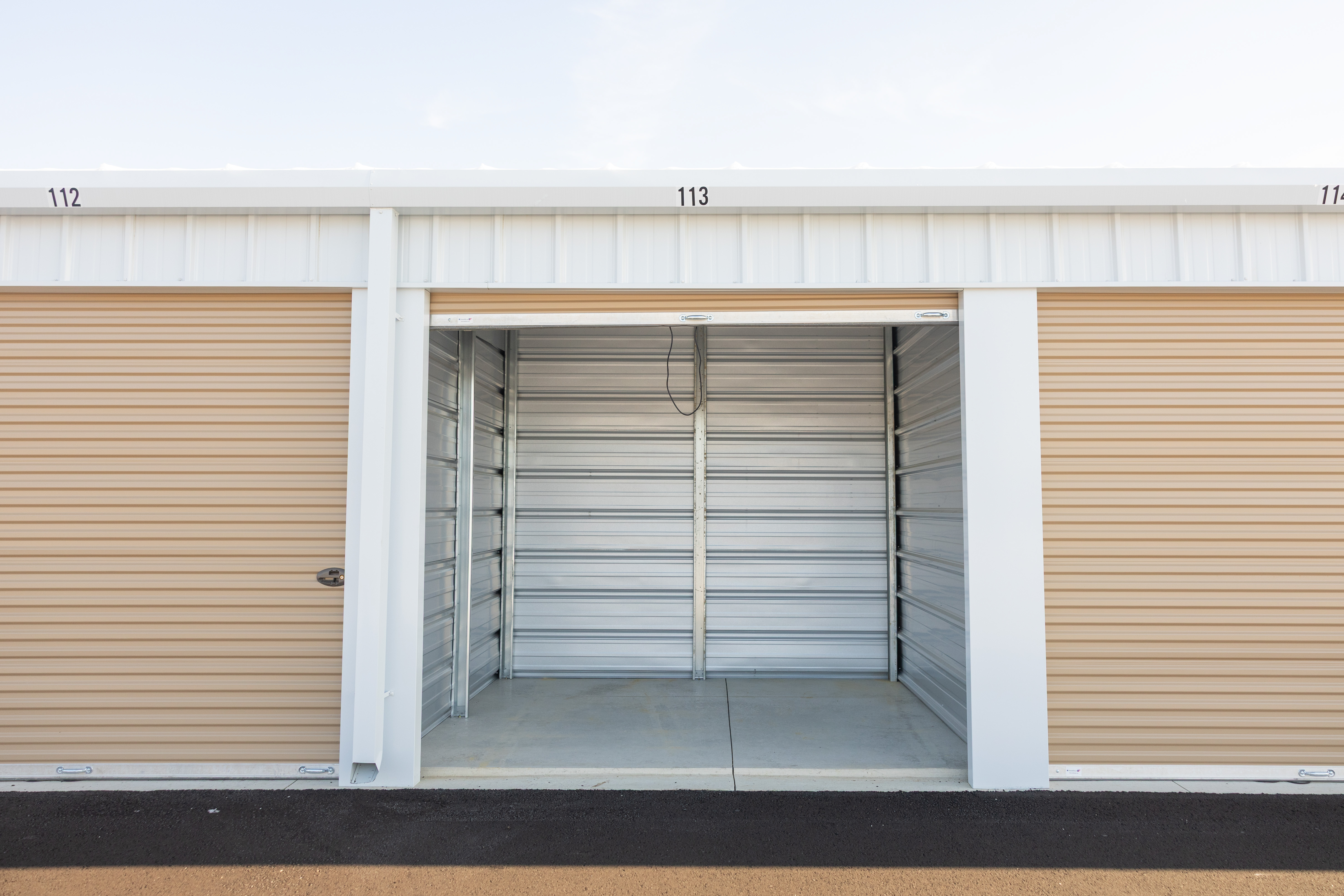 Clean storage unit with roll-up door