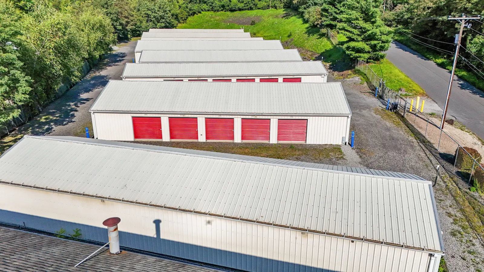 Aerial view of UrbanLock self-storage facility in Scranton showing multiple storage buildings, secure gated property, and wooded surroundings
