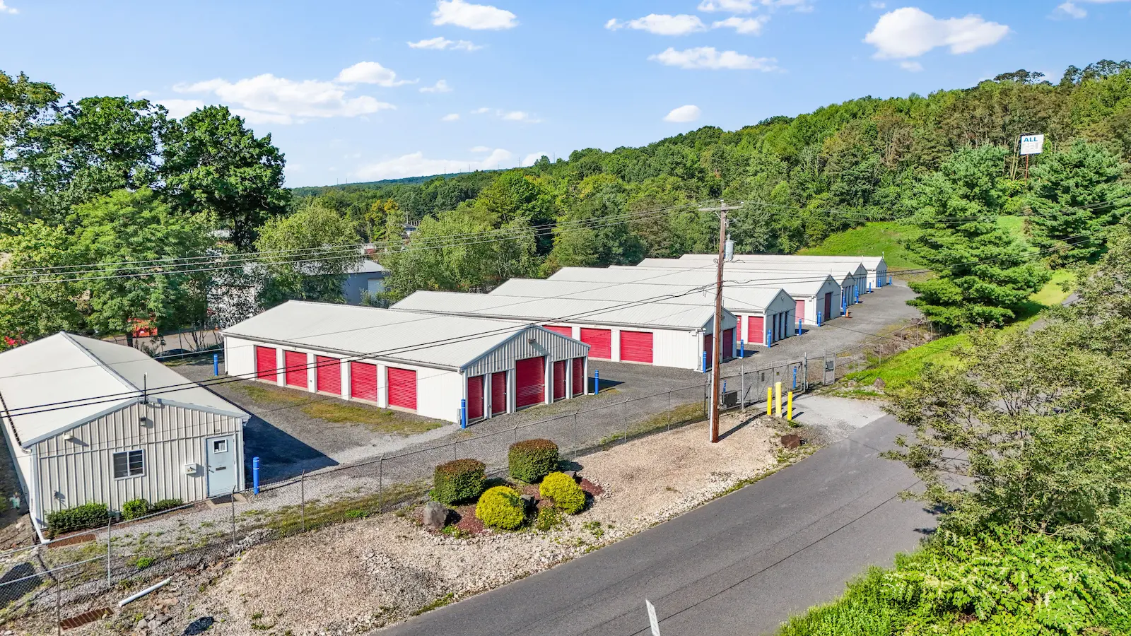UrbanLock self-storage facility in Scranton with multiple storage buildings, office building, secure gated access, and mountainous wooded setting