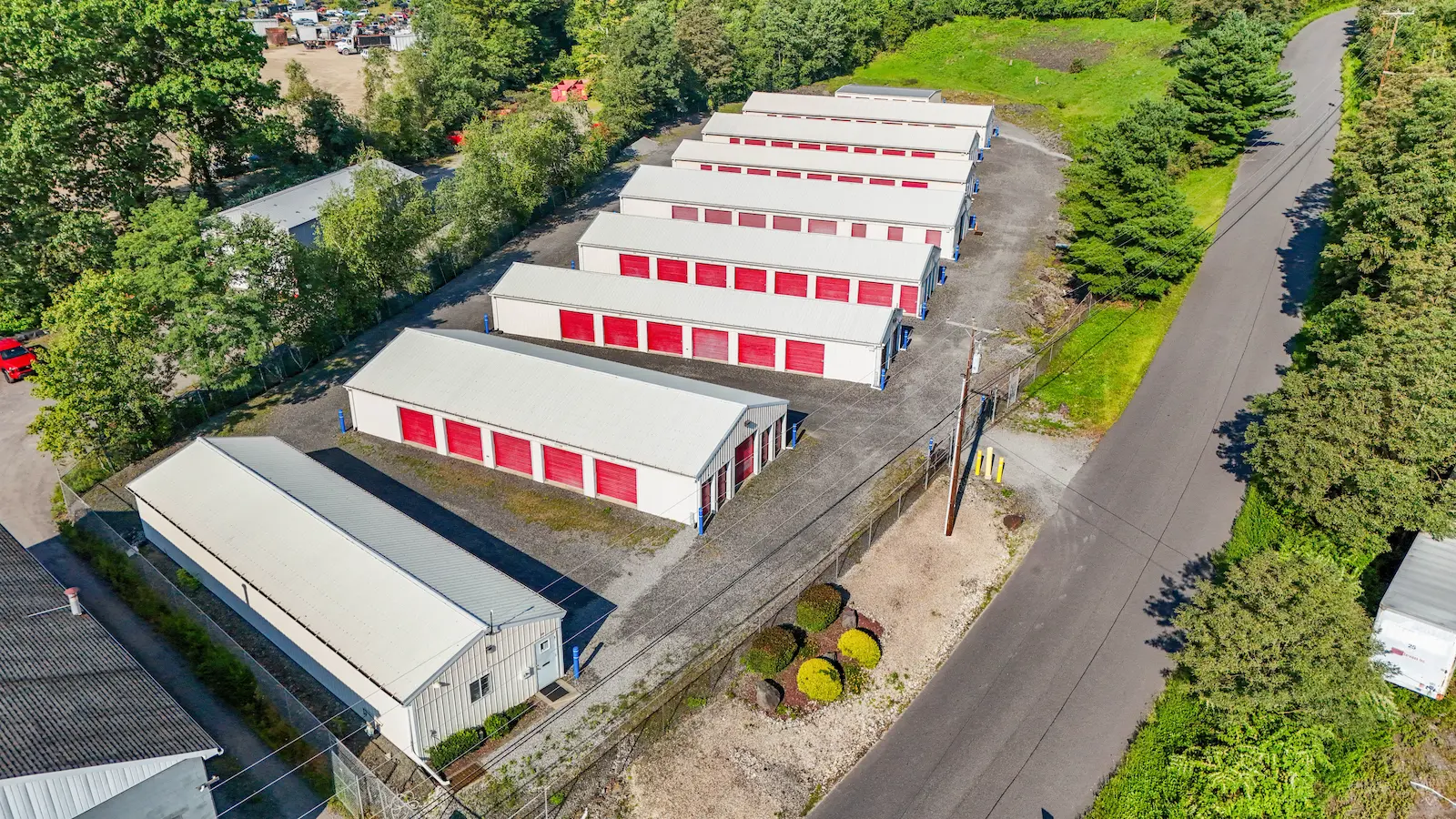 Aerial view of UrbanLock self-storage campus in Scranton showing organized rows of drive-up storage buildings, office building, secure fencing, and manicured landscaping