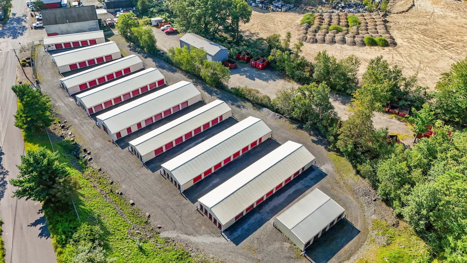 Aerial view of UrbanLock self-storage facility in Scranton showing multiple storage buildings with organized drive-up rows, secure layout, and surrounding property