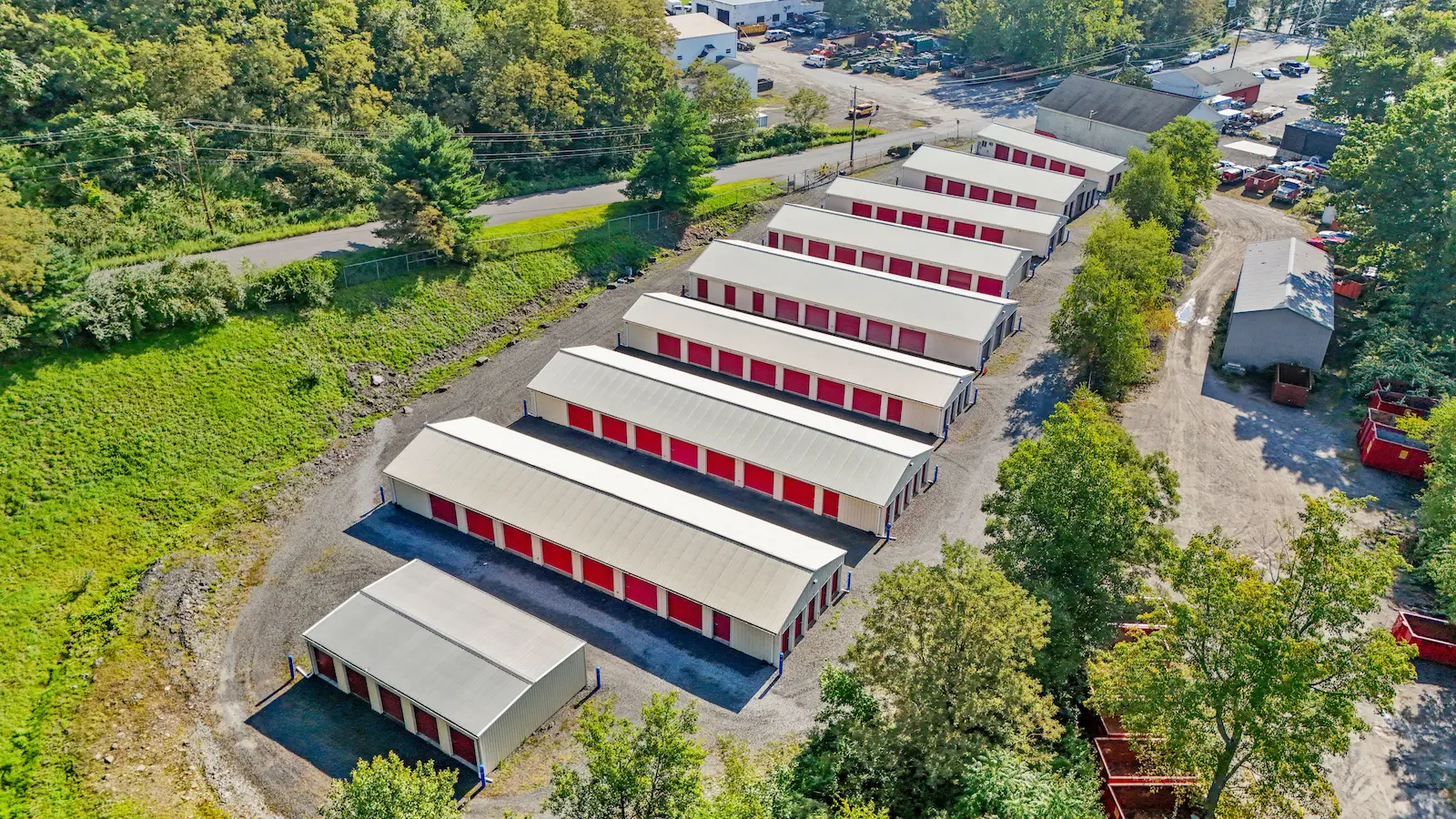Aerial view of UrbanLock self-storage facility in Scranton showing parallel rows of drive-up storage buildings with easy access lanes and wooded perimeter