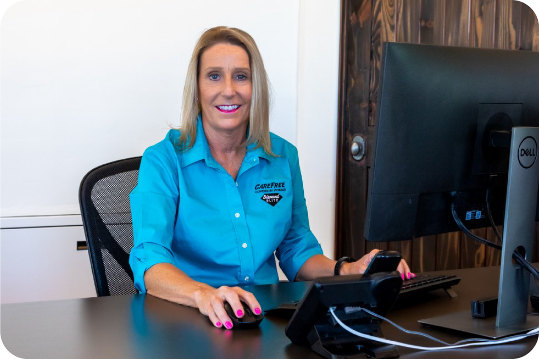 Meet the Friendly Site Manager at Apache Junction RV Storage Engaged site manager at her desk in Carefree Apache Junction office