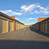 Picture of a Bargain Storage facility with drive up units and roll up doors