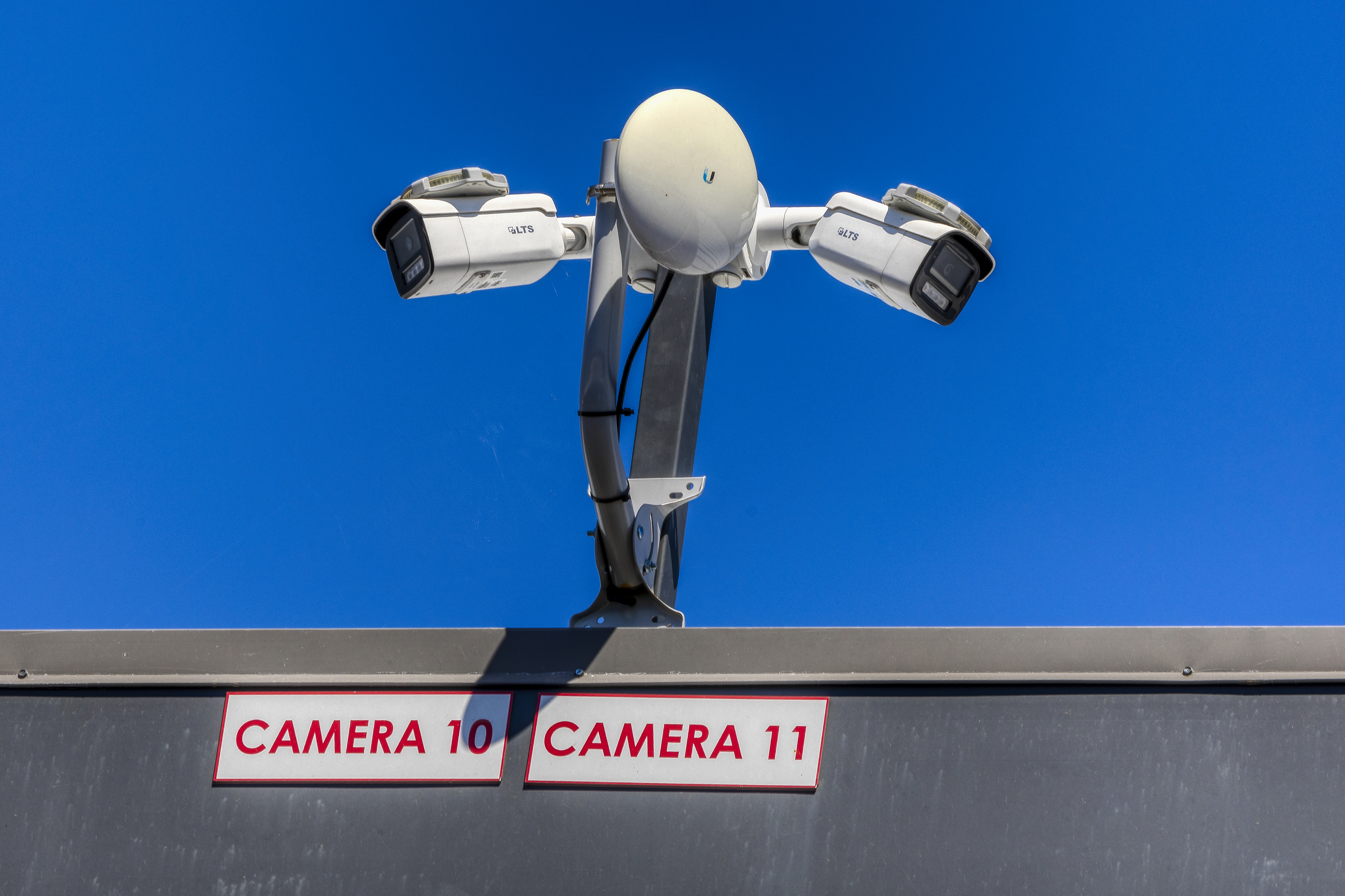 High-definition security surveillance cameras labeled Camera 10 and Camera 11