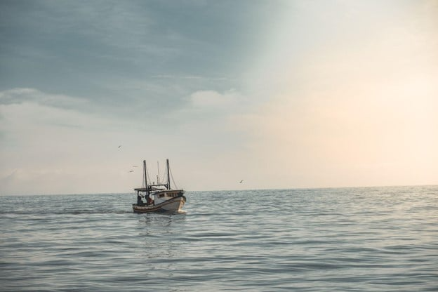 A fishing boat out on the open sea