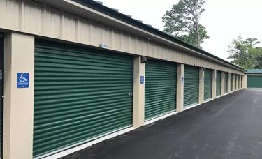 Large storage units with green rollup doors at Store & Go Self Storage Beaufort, SC