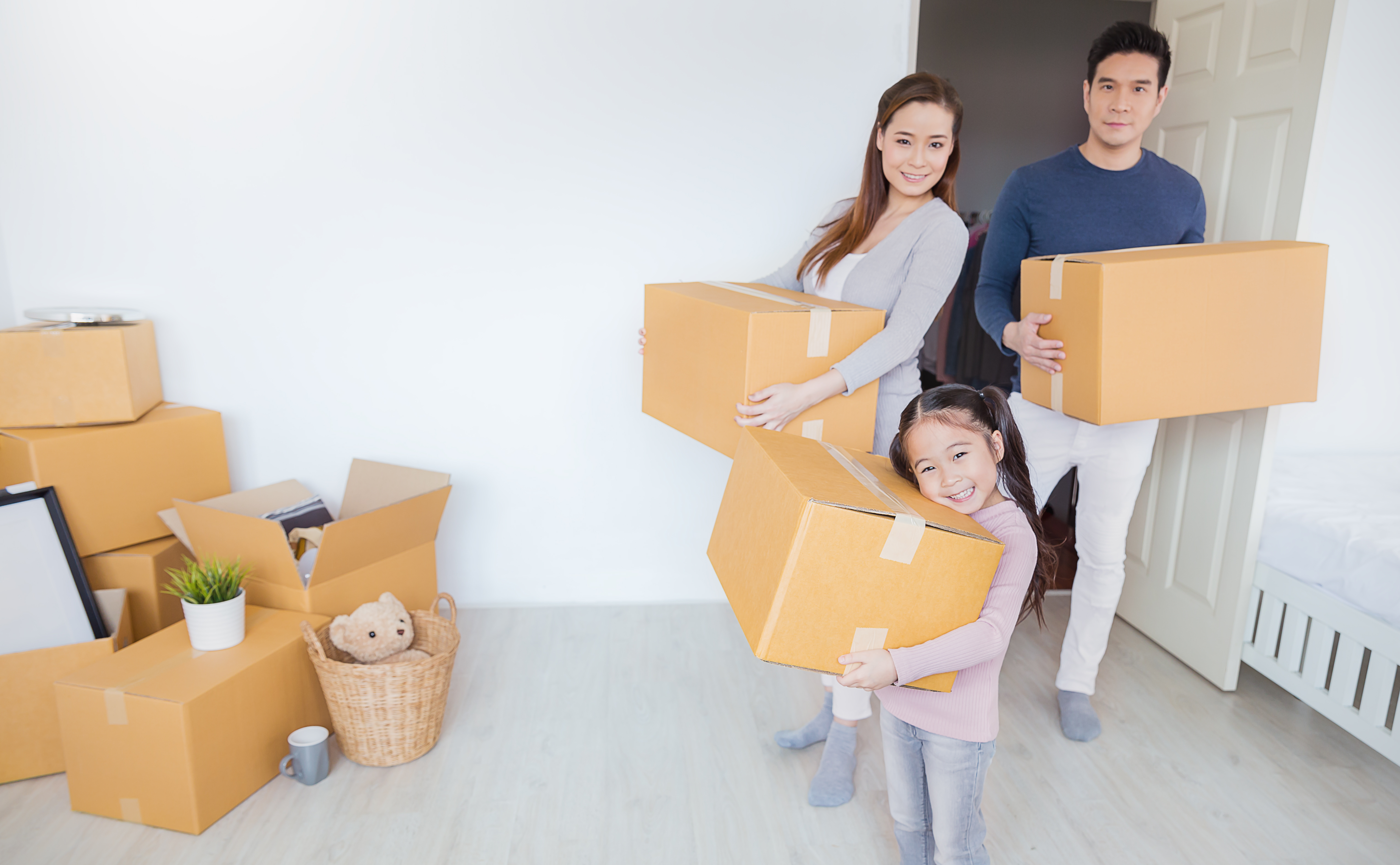 Parents and child packing boxes for their storage unit in Cincinnati