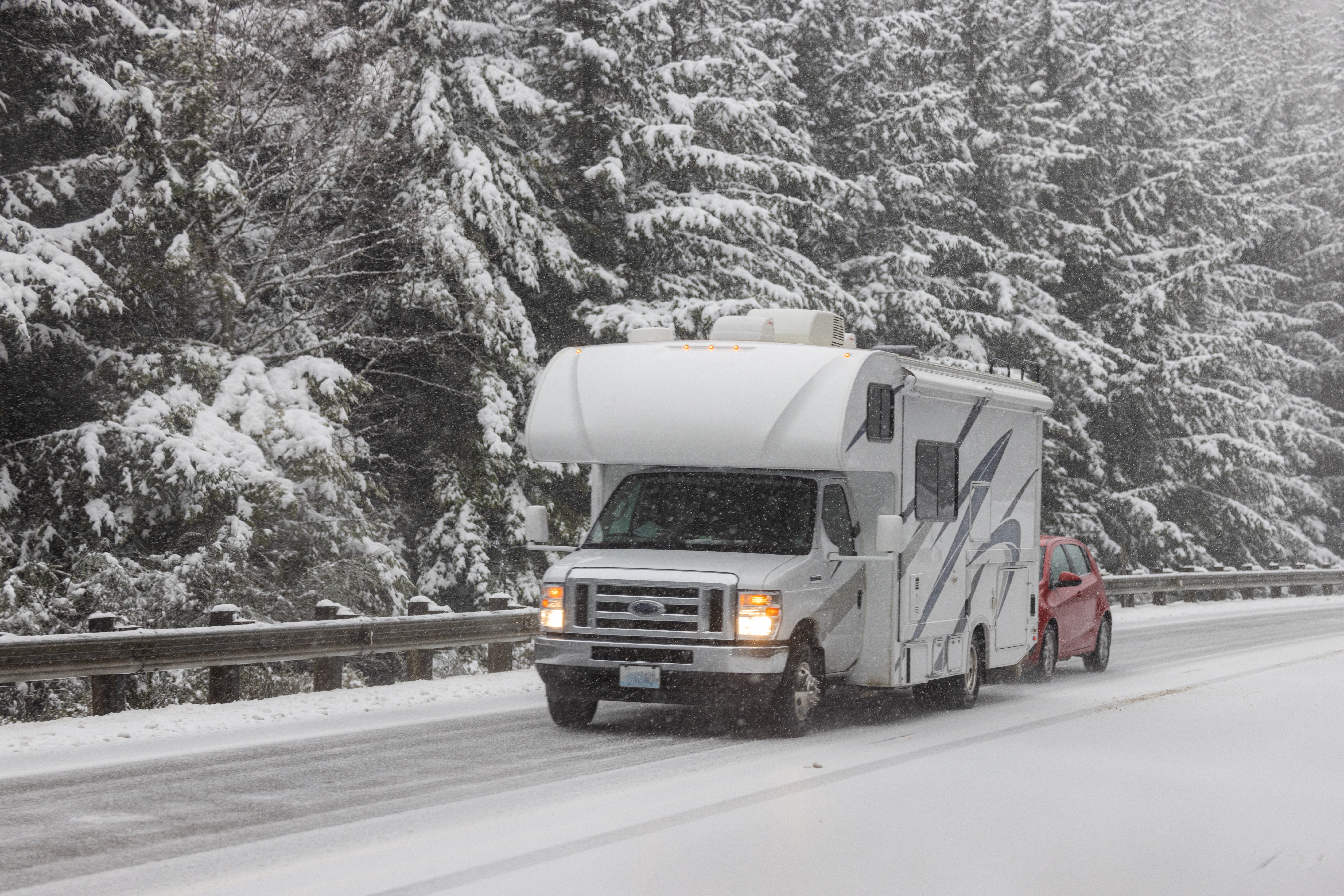 RV driving on fresh snow in the winter