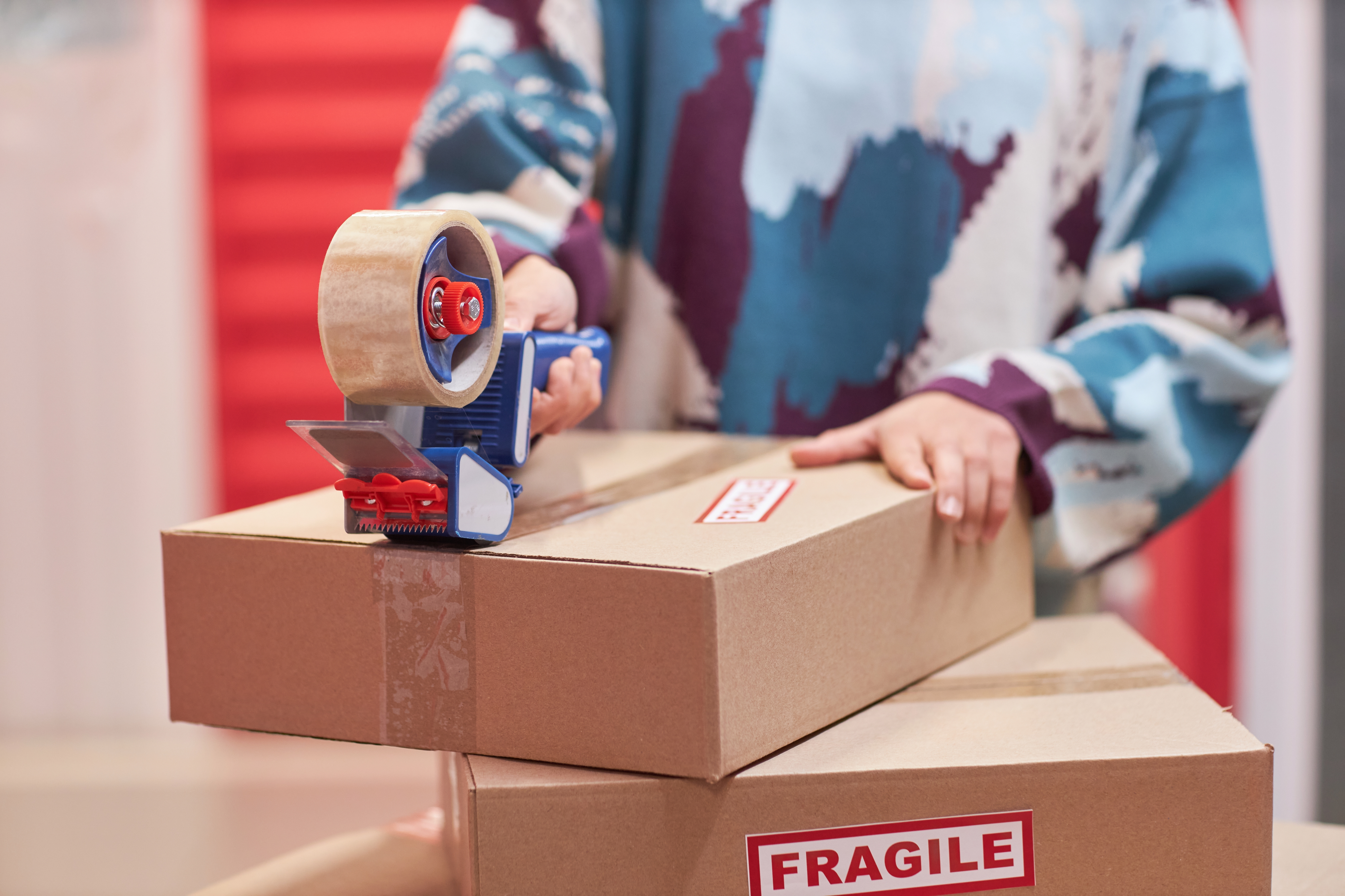 Woman taping boxes at her Cincinnati storage unit