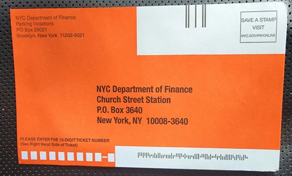 An orange envelope going to NYC Department of Finance