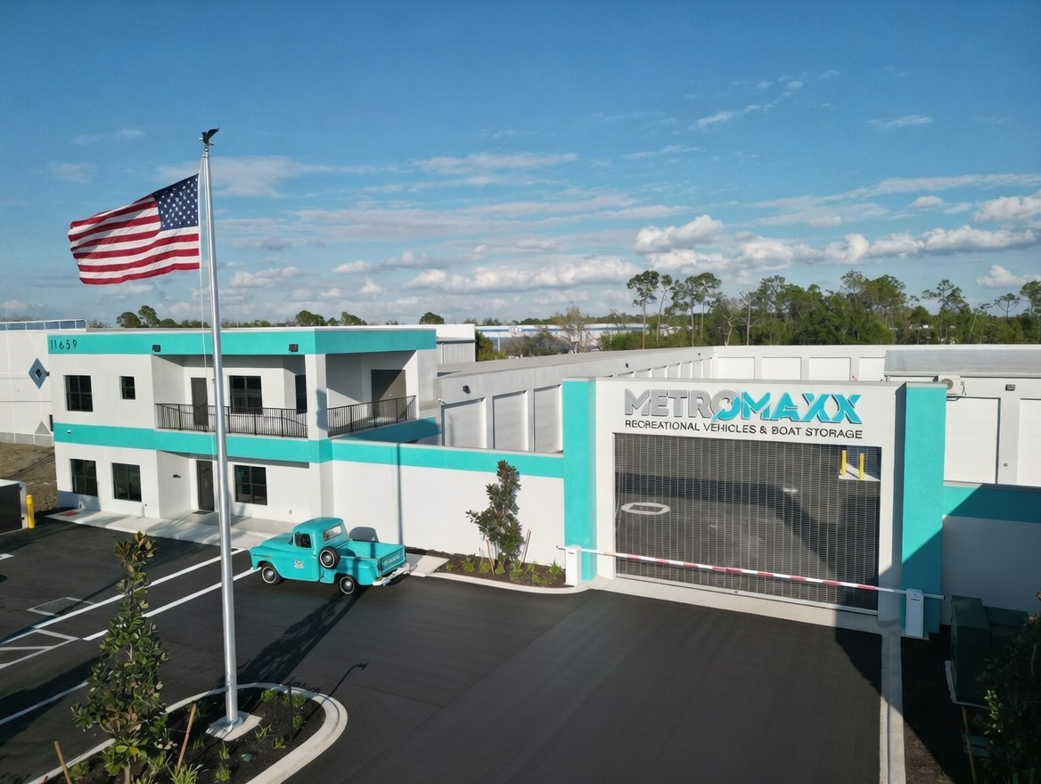 Front entrance gate and office building at MetroMaxx RV and Boat Storage featuring secure gated access and premium recreational vehicle storage in Fort Myers.