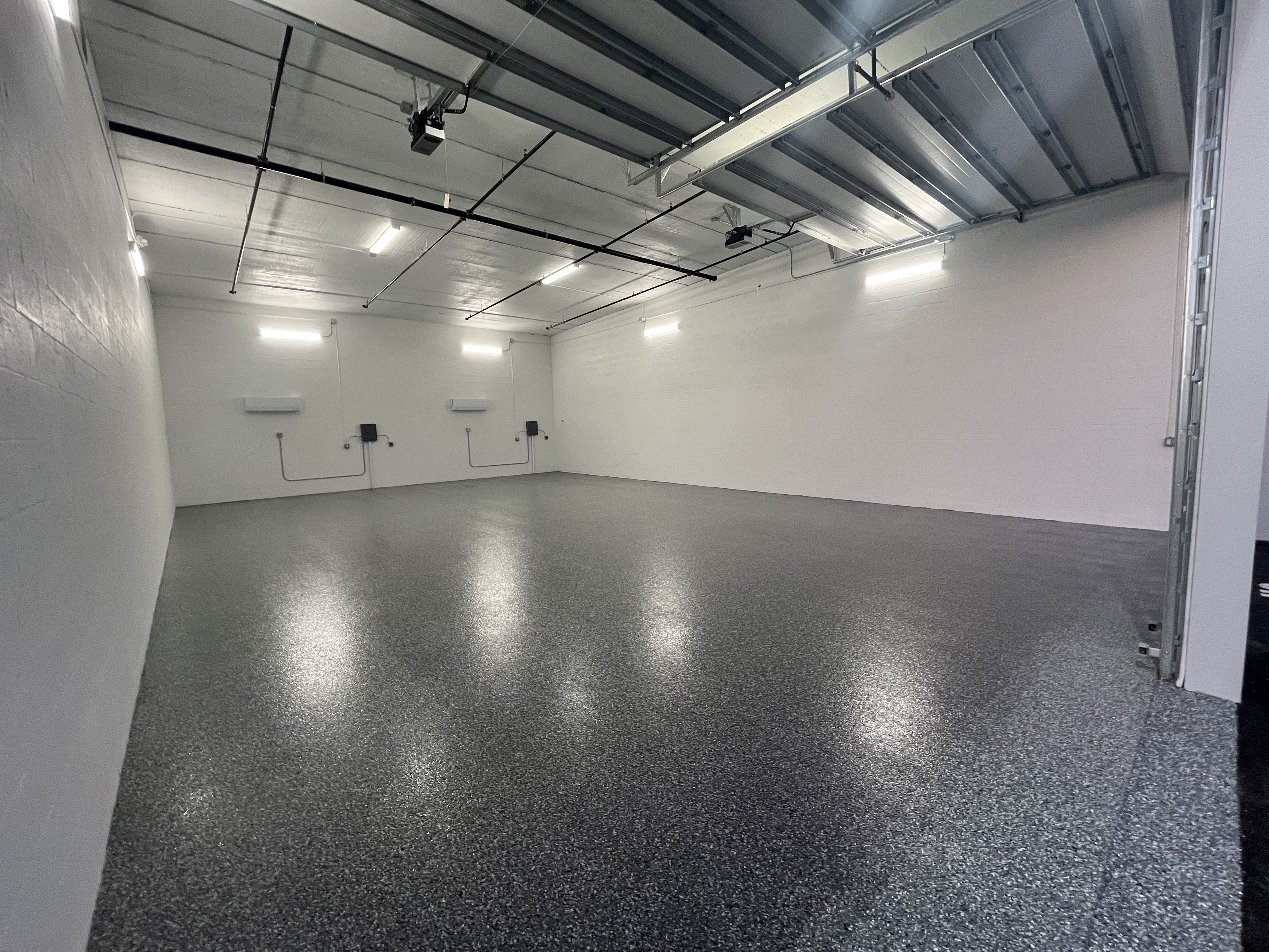 32' x 50' double-wide climate-controlled storage unit at MetroMaxx in Fort Myers with epoxy floor, wall-mounted AC, and wide roll-up door