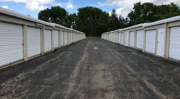 outdoor storage units with white rollup doors Storage Units of All Sizes with Drive Up Access