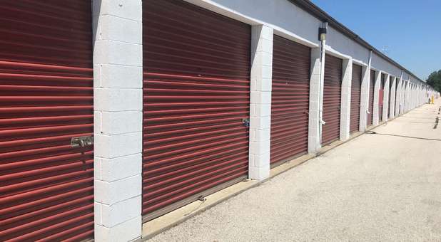 large outdoor storage units with red rollup doors Large outdoor storage units at U-Store Self Storage - Holland