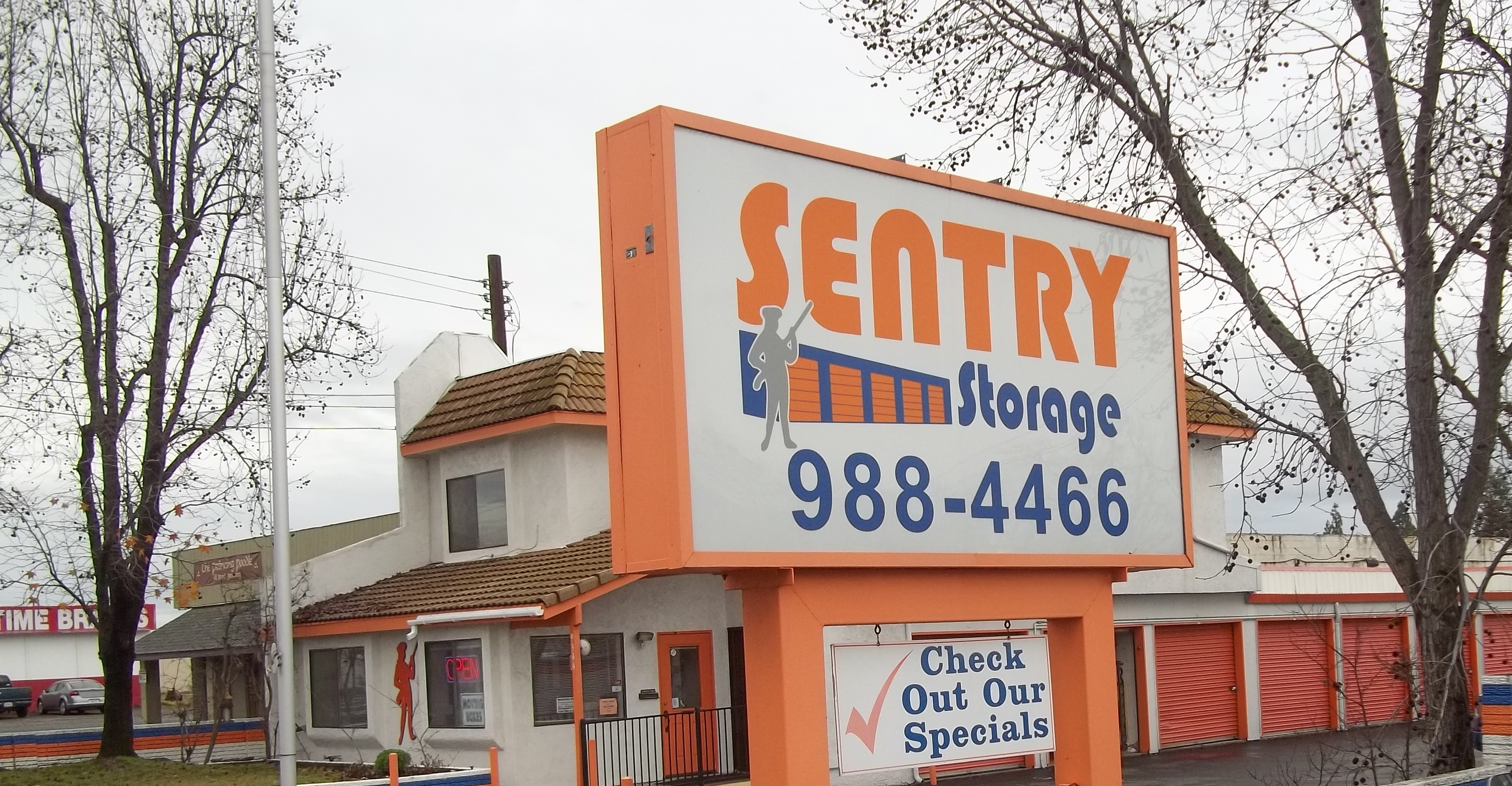 Sentry Storage signage near street on 9344 Greenback Ln