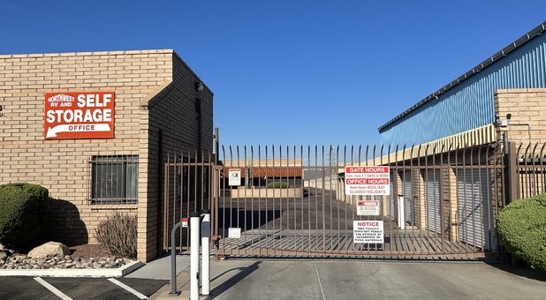front entrance to a storage facility, fenced with an automatic gate