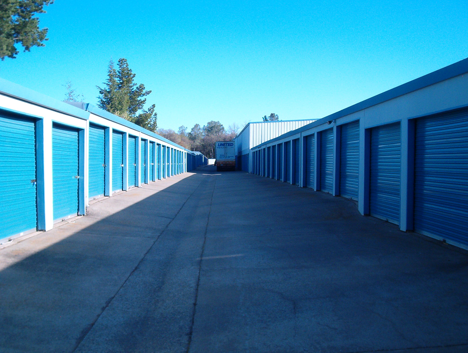 View of wide aisle between storage buildings at Sentry Storage 4041 Wild Chaparral Dr