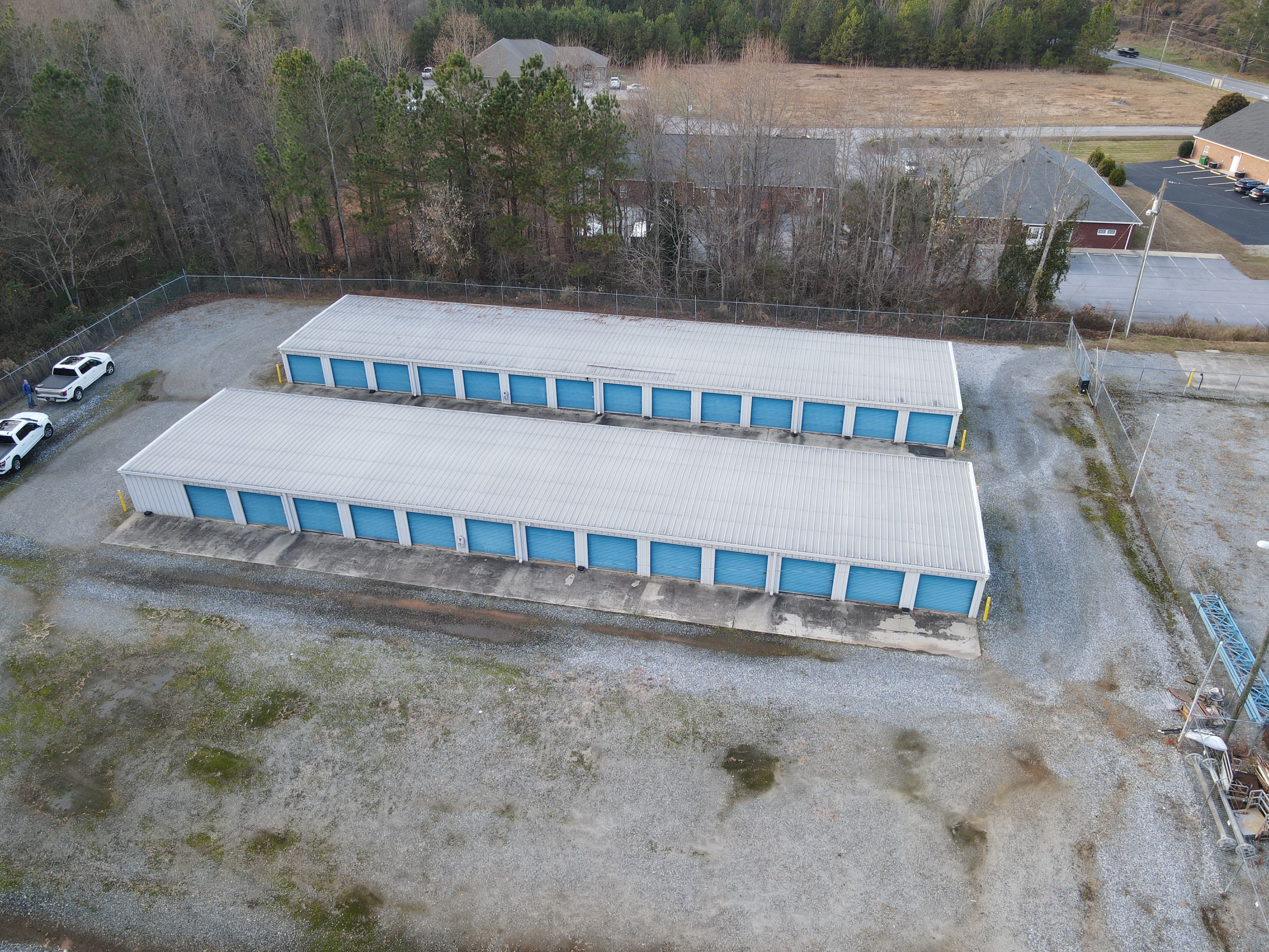 overhead view of two storage buildings with drive up access units