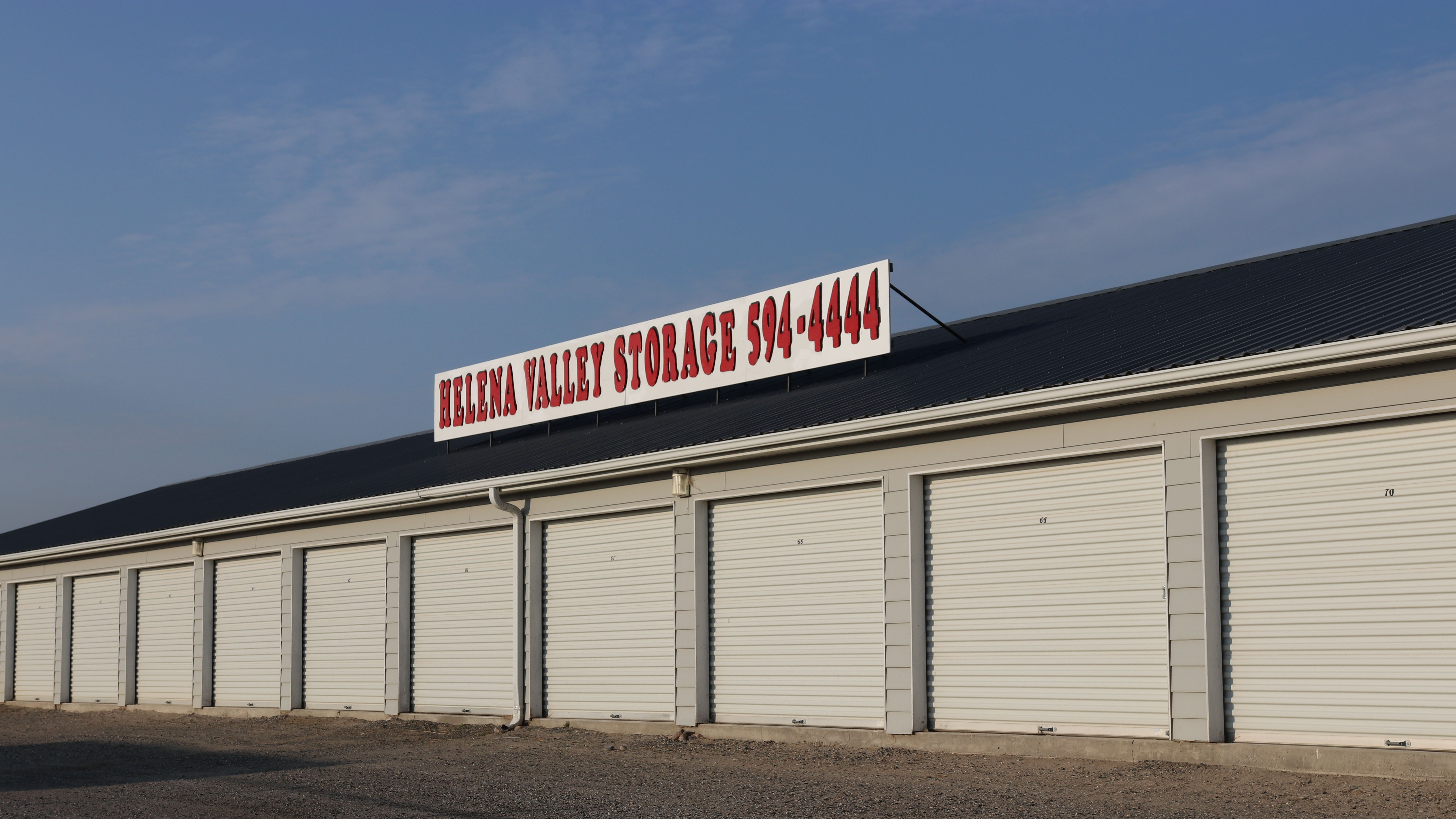 Extetior storage units with Helena Storage sign on building