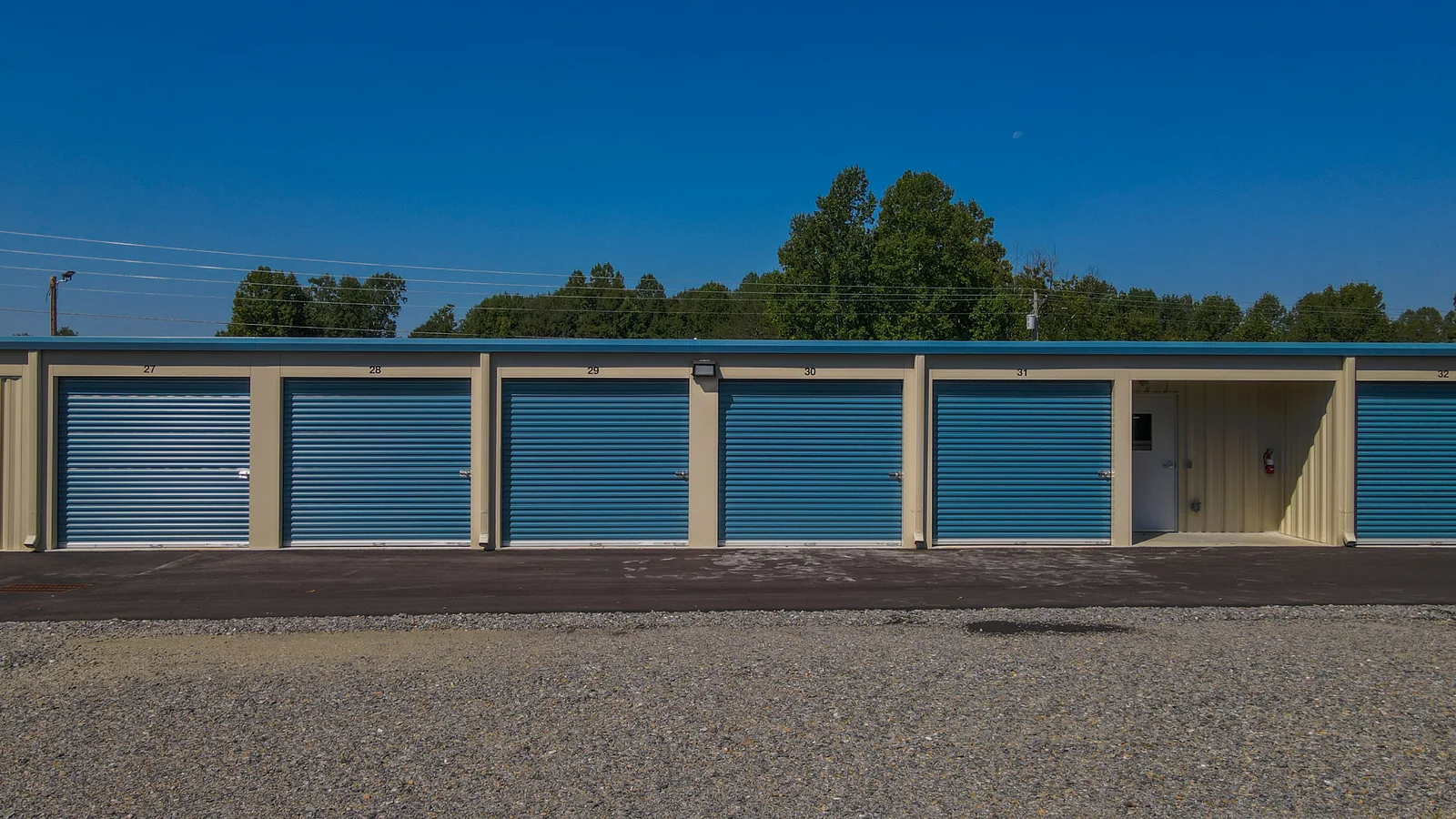 Row of blue drive-up storage units 27 through 32 at 601 Self Storage in Mocksville, NC